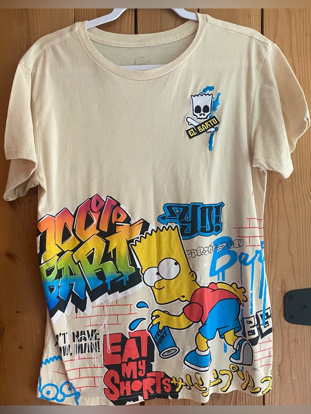 Fashion Nova Cream Bart Simpson Kids Tee with Multicolor Graffiti Eat My Shorts